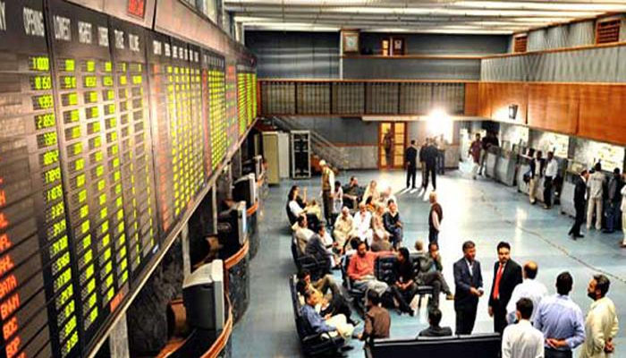 Traders pictured during business hours in the premises of the Pakistan Stock Exchange. — AFP/File