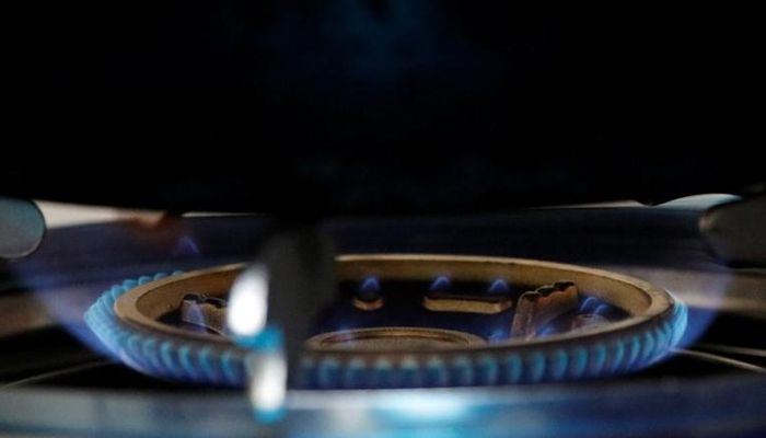 A gas flame burns on a newly installed stove in a kitchen in Xiaozhangwan village on the outskirts of Beijing, China, November 15, 2017. — Reuters/File