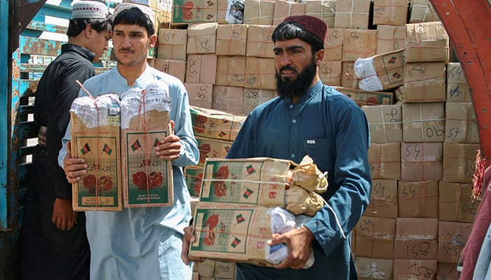 Labourers unload boxes of pomegranates from Afghanistan, from a truck at the Friendship Gate crossing point, in the Pakistan-Afghanistan border town of Chaman, Pakistan, September 7, 2021. — Reuters/File