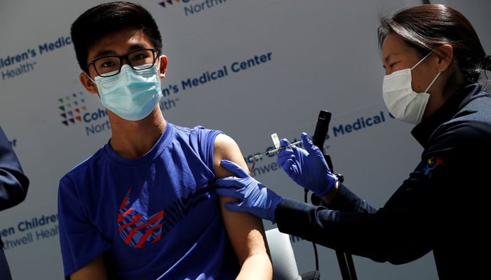 Thomas Lo (15) receives a dose of the Pfizer-BioNTech vaccine for the coronavirus disease (COVID-19) at Northwell Healths Cohen Childrens Medical Center in New Hyde Park, New York, US, May 13, 2021. — Reuters/File