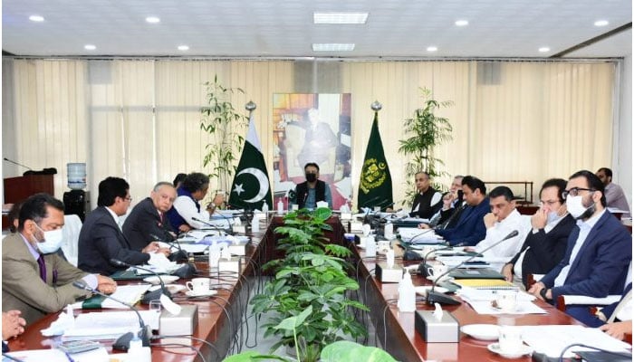 Federal Minister for Planning, Development and Special Initiatives Asad Umar chairing the meeting ofCabinet Committee on Energy. — APP