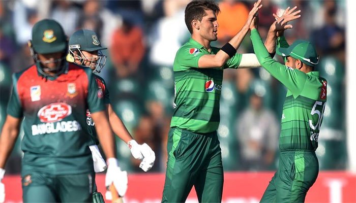 Shaheen Afridi and Babar Azam celebrate after taking a wicket. Photo: AFP