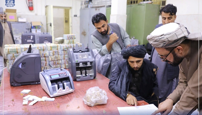 Men are pictured as Afghanistans Taliban-controlled central bank seizes a large amount of money in cash and gold from former top government officials, including former vice president Amrullah Saleh, in Afghanistan, in this handout obtained by Reuters on September 15, 2021. — Reuters