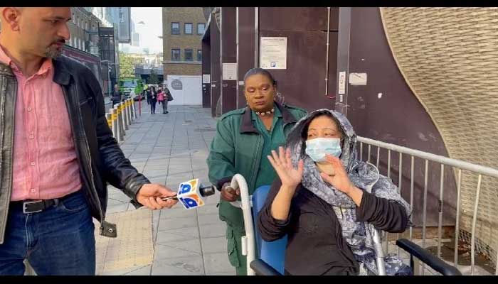 The widow of MQM leader Dr Imran Farooq, Shumail Imran Farooq, declines to speak as she is wheeled by a nurse at a hospital in London. — Photo provided by author