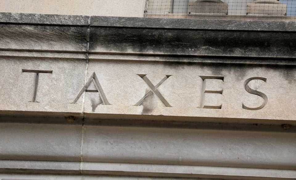 The word taxes is seen engraved at the headquarters of the Internal Revenue Service (IRS) in Washington, D.C., US, on May 10, 2021. REUTERS/Andrew Kelly