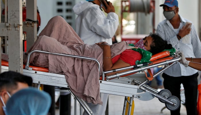 A patient is wheeled inside a COVID-19 hospital for treatment, amidst the spread of the coronavirus disease (COVID-19) in Ahmedabad, India, April 19, 2021. — Reuters/File