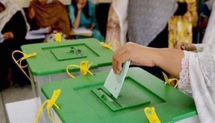 A woman can be seen casting her vote. — File photo