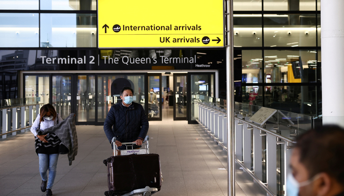 Travellers walk through Terminal 2 at Heathrow Airport, amid the coronavirus disease (COVID-19) outbreak in London, Britain February 14, 2021. — Reuters/File