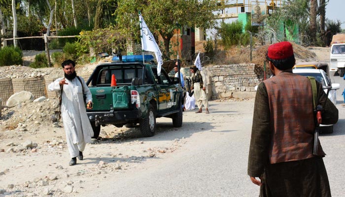 Taliban members inspect near the site of a blast in Jalalabad on September 18,2021. — AFP