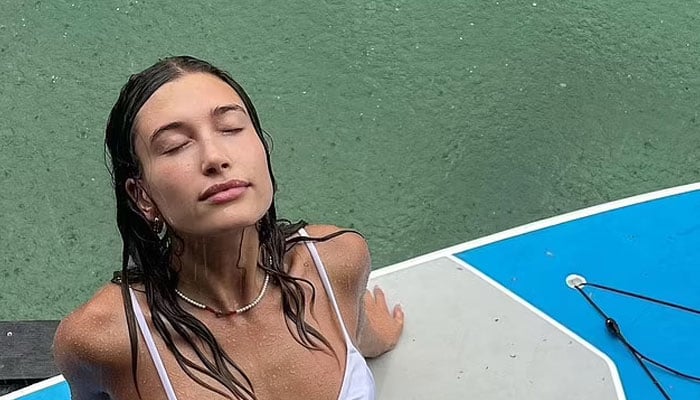 Hailey Bieber shows off her impressively fit figure in holiday photos with husband Justin Bieber
