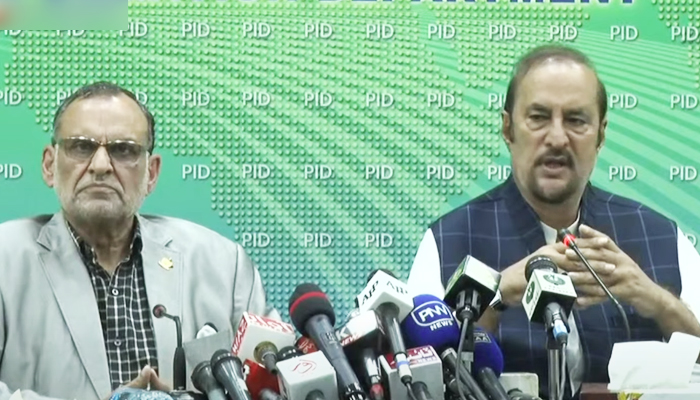 Advisor to the Prime Minister on Parliamentary Affairs Dr Babar Awan (right) addressing a press conference alongside Federal Minister for Railways Azam Khan Swati in Islamabad, on September 20, 2021. — YouTube/HumNewsLive