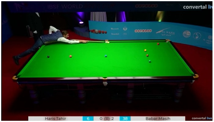 Pakistani snooker player Babar Masih trying to pocket a ball at a match of IBSF 6 Reds World Cup.