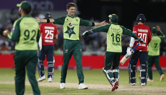 Cricket - First Twenty20 International - England v Pakistan - Trent Bridge, Nottingham, Britain - July 16, 2021 Pakistans Shaheen Afridi celebrates with teammates after taking the wicket of Englands Matt Parkinson to win the match. — Reuters/File