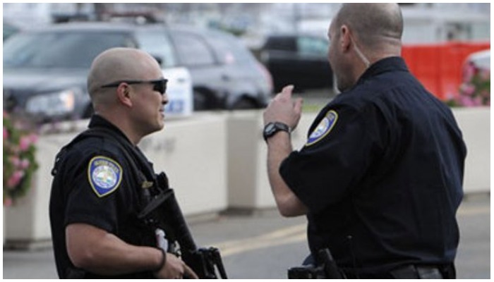 Police officers at a crime scene. Photo AFP