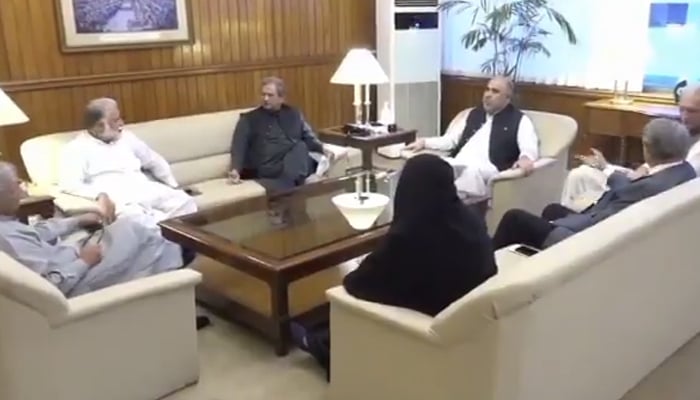 National Assembly Speaker Asad Qaiser (sitting on the centre chair) holds withOpposition and government lawmakers in Islamabad, on September 21, 2021. — Twitter/