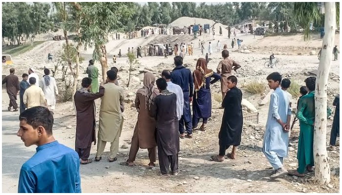 People gathered at the site of the attack in Nangarhar province of Afghanistan — AFP