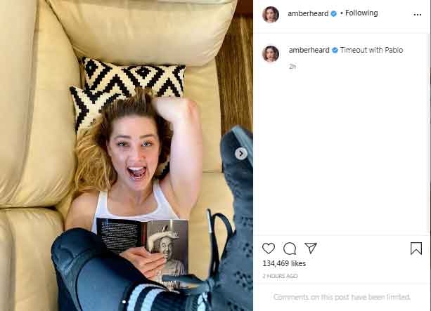 Amber Heard enjoys reading Pablo Neruda book as Johnny Depp condemns cancel culture