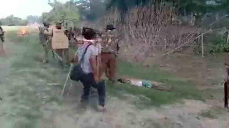 Screengrab shows Indian policemen beating a man lying motionless after being shot.