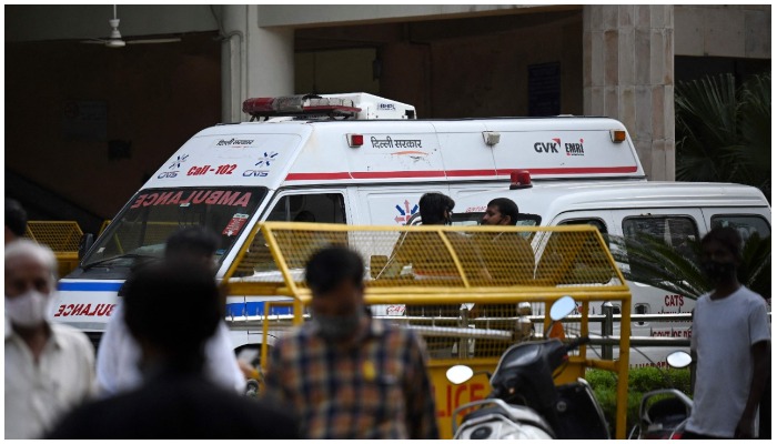 An ambulance is seen inside the Rohini court in New Delhi on September 24, 2021, after a notorious Indian gangster was killed by gunmen dressed as lawyers in a bloody shootout in a courtroom where three people died, local media reported. (Photo by Money SHARMA / AFP)