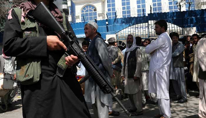 A Taliban security member holding a rifle ensures order in front of Azizi Bank in Kabul, Afghanistan, September 4, 2021. — WANA (West Asia News Agency) via Reuters