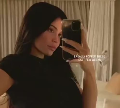 Kylie Jenner flaunts her growing baby bump for fans in new snap