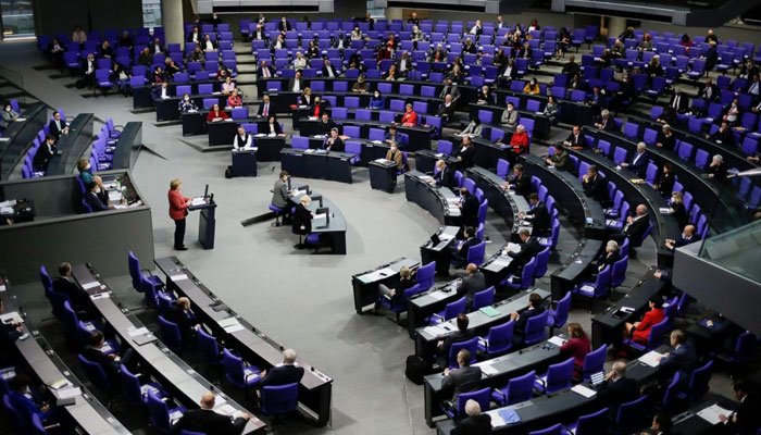 German Chancellor Angela Merkel delivers her speech at the parliament Bundestag in Berlin: Photo: File/AP