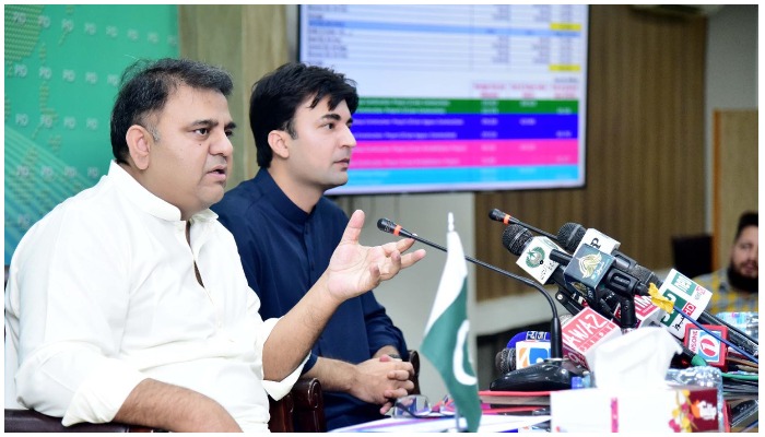 Federal ministers Fawad Chaudhry and Murad Saeed addressing a press conference in Islamabad — PID