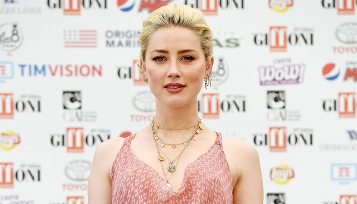 Amber Heard shows off multi-tasking skills as a new mom
