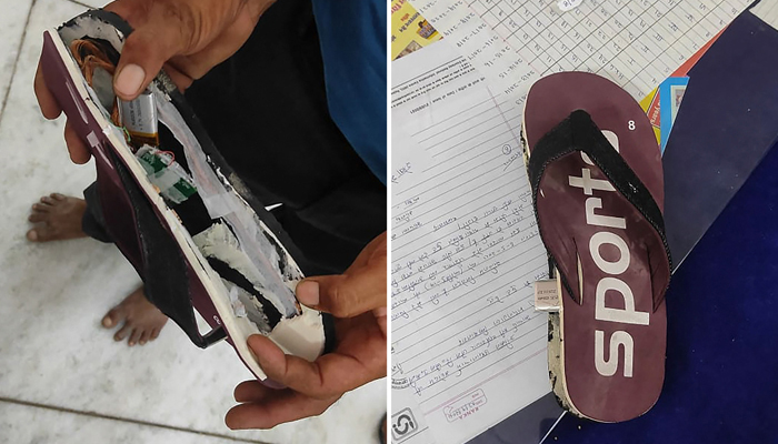 This combination created of photos taken on September 26, 2021, a man shows a flip-flop with concealed bluetooth device (L) and a flip-flop with concealed bluetooth device in Ajmer. — AFP