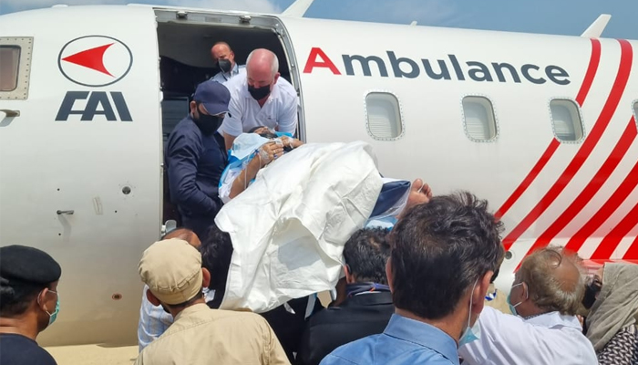 Celebrated veteran actor and comedian Umer Sharif is being shifted to the air ambulance under the supervision of his family members and a team of doctors. — Photo by author