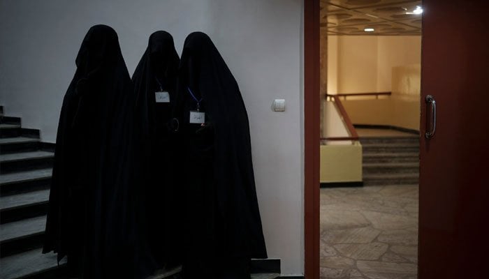 Female students standing inside an Afghan university. Photo AP