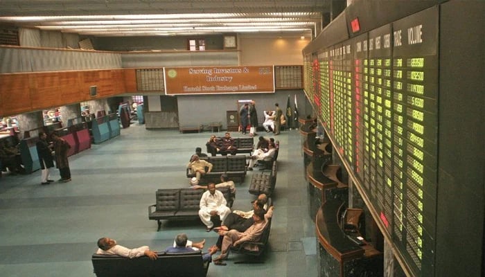 Investors sitting in the main hall of the Pakistan Stock Exchange. — AFP