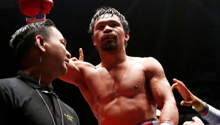 Boxing - WBA Welterweight Title Fight - Manny Pacquiao v Lucas Matthysse - Axiata Arena, Kuala Lumpur, Malaysia - July 15, 2018 Manny Pacquiao celebrates after winning the bout against Lucas Matthysse. Picture taken July 15, 2018. — Reuters/File