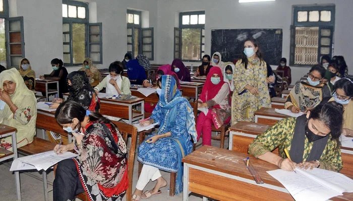 Students are busy solving their question papers during the matriculations annual examination at Government Post Graduate Islamia College in Lahore, on July 30. Photo: ONLINE.