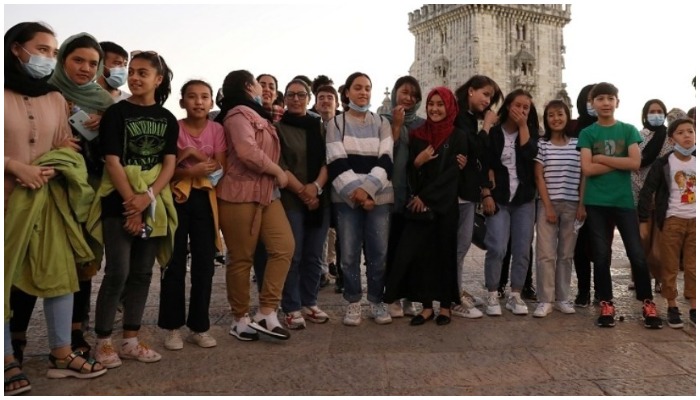 Players of Afghanistans national womens football team stand near the Belem Tower in Lisbon, Portugal on Wednesday. — Reuters