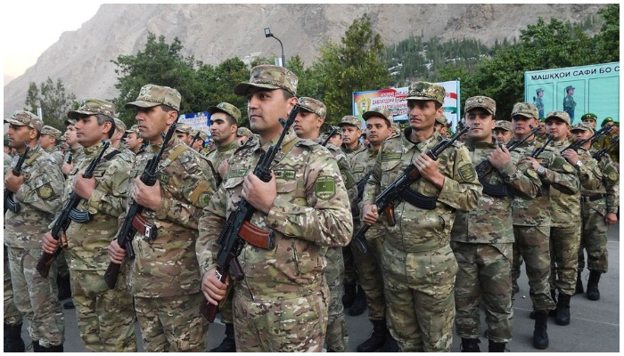 Tajik service members take part in a military parade near the border with Afghanistan in the town of Khorog (Khorugh), Tajikistan September 30, 2021 — REUTERS
