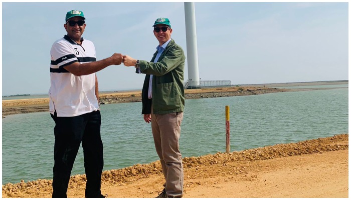 Special Assistant to Prime Minister on Climate Change Malik Amin Aslam (left) and British High Commissioner Dr Christian Turner can be seen fist-bumping. — British High Commission, Islamabad