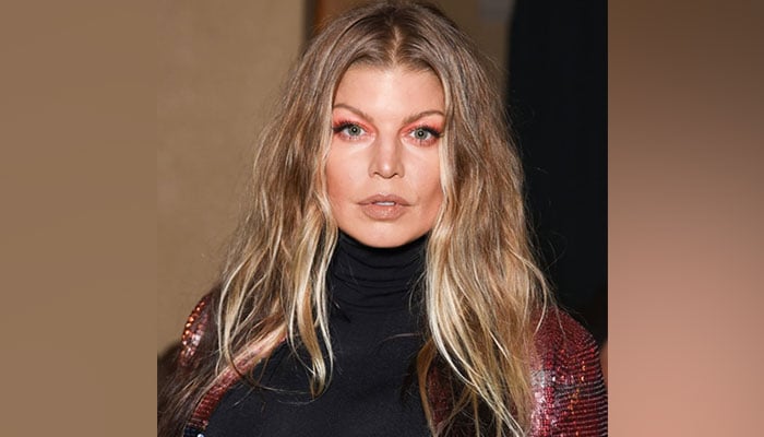 Fergie pens touching note to late father