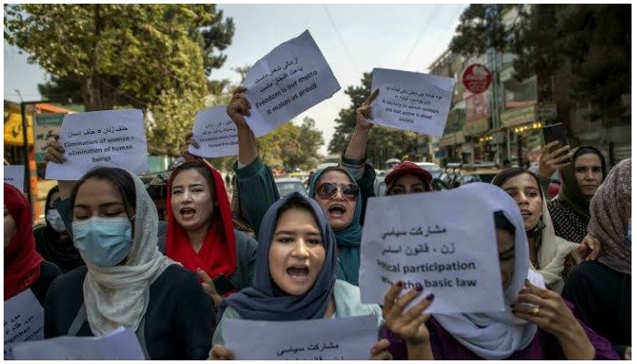 About a dozen Afghan women protest outside the old Ministry for Womens Affairs, after it was replaced by a department that earned notoriety for enforcing strict islamic doctrine in Afghanistan. Photo: AFP