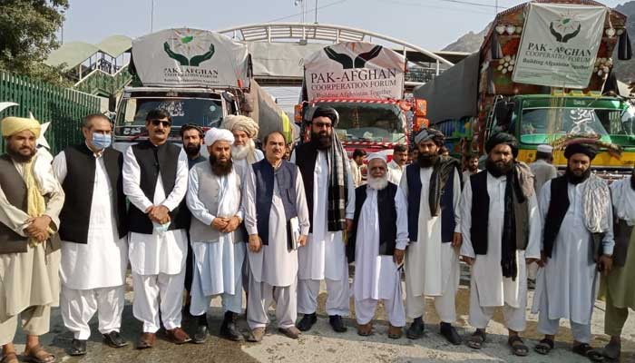 Pakistan and Afghan officials during the handing over ceremony of aid trucks, at the Torkham border, on October 3, 2021. — Photo courtesy Pak-Afghan Cooperation Forum