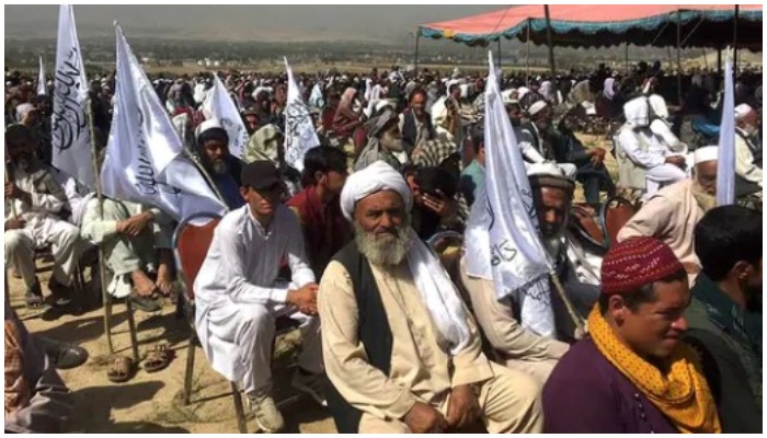 Taliban supporters attend an open-air rally in a field in Kabul on October 3, 2021. Photo by Hoshang HASHIMI / AFP.