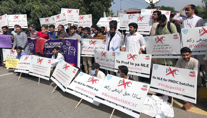 Young Doctors holds placards and shout slogans during a protest outside the Pakistan Medical Commission (PMC) in Islamabad, on October 5, 2019. — Online