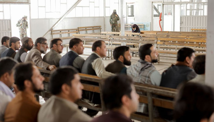 An Afghan female journalist attends a Taliban officials news conference where they announced they will start issuing passports to its citizens again following months of delays that hampered attempts by those trying to flee the country after the Taliban seized control, in Kabul, Afghanistan October 5, 2021. —Reuters