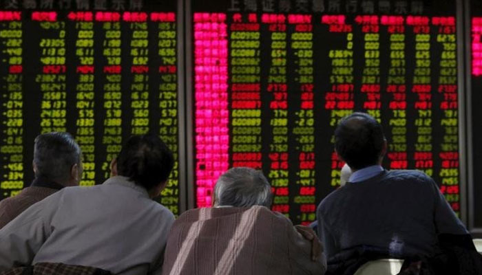 Investors can be seen looking at the stock board. — Reuters/File