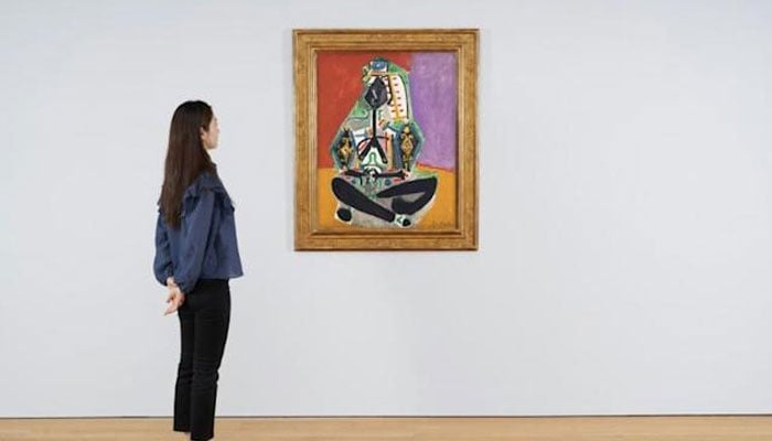 Two Picasso paintings, including Crouching Woman in Turkish Costume (Jacqueline) will go on auction at Christies fall sale in November 2021. AFP