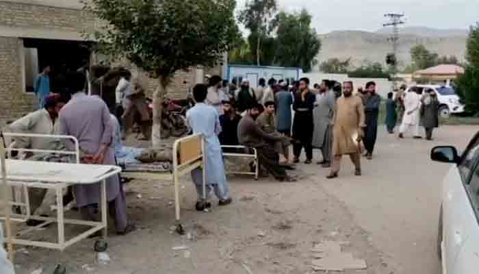 People gather outside a hospital following an earthquake in Harnai, Balochistan, Pakistan, October 7, 2021, in this still image obtained from video. Photo: Reuters