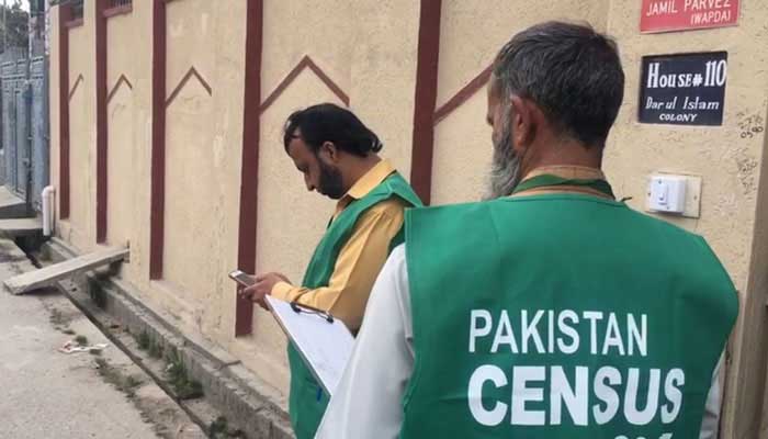 A file photo of an enumerator conducting a door-to-door survey during the 2017 census in Pakistan.