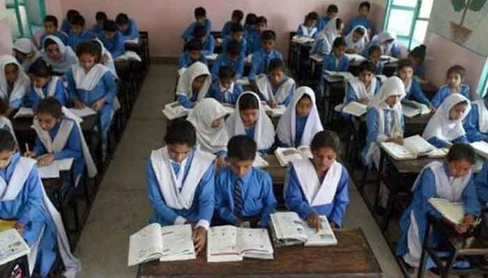 Schools children attending a class. File photo