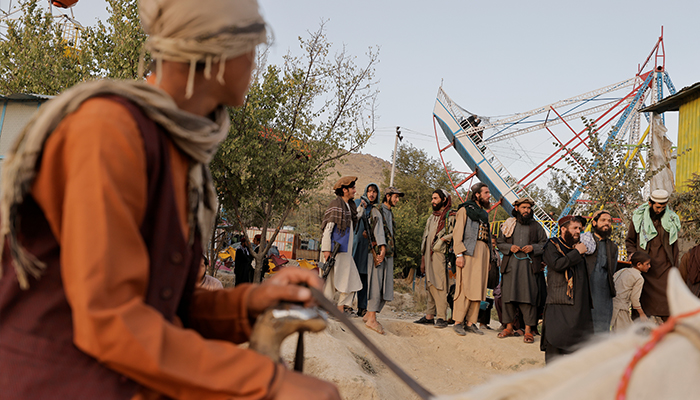 Taliban fighters look at the sunset as they take a day off to visit the amusement park at Kabuls Qargha reservoir, at the outskirts of Kabul, Afghanistan October 8, 2021. Picture taken October 8, 2021. — Reuters