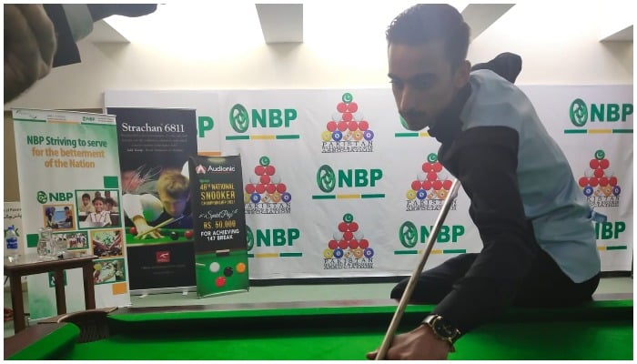 Ahsan Ramzan playing snooker. Photo provided by the reporter.